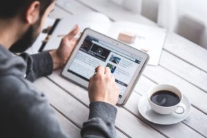 man reading on a tablet